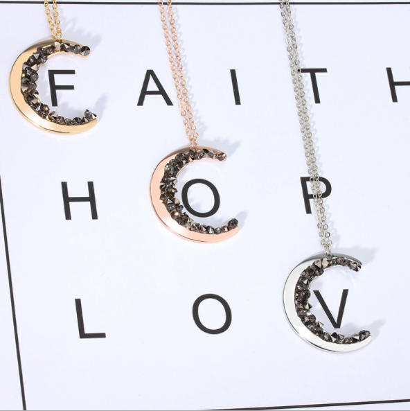 CRYSTAL MOON NECKLACE –