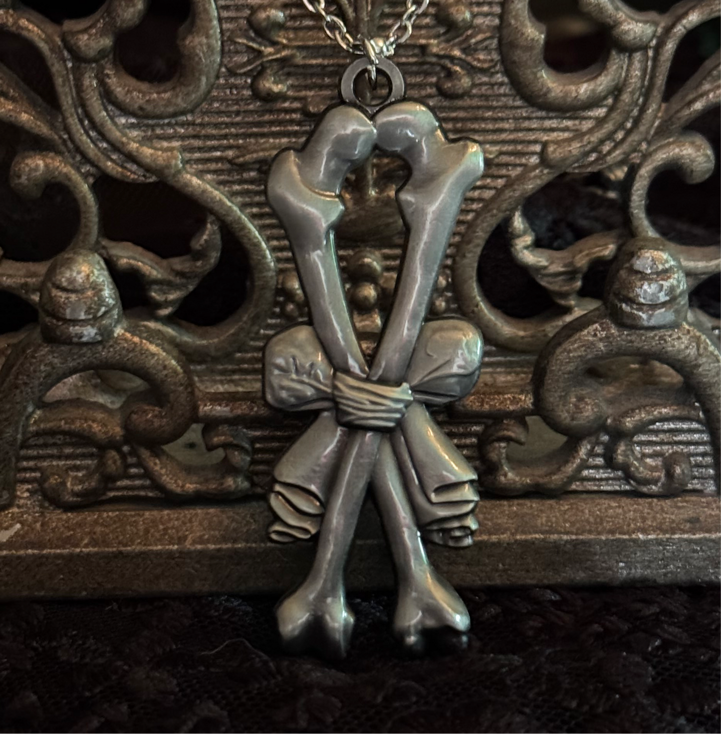 Carved In Stone- Bow and Bones – Adornments