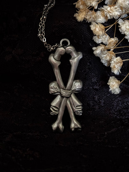 Carved In Stone- Bow and Bones – Adornments