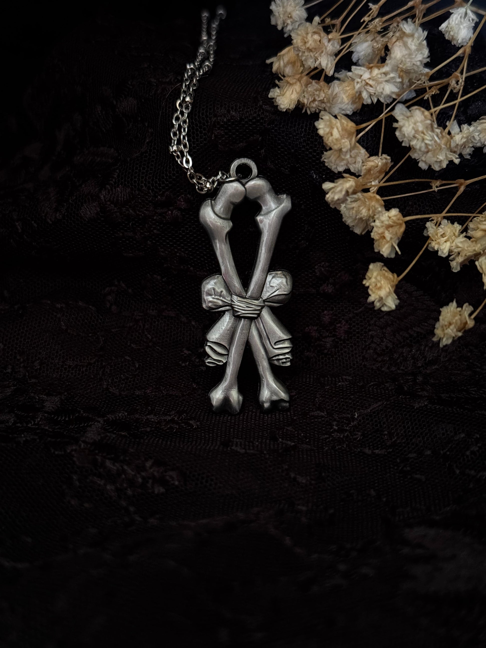 Carved In Stone- Bow and Bones – Adornments