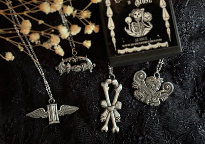 Carved In Stone- Bow and Bones – Adornments