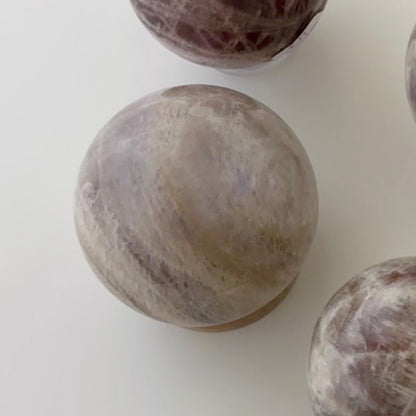 Sunstone in Moonstone Sphere – 63 mm
