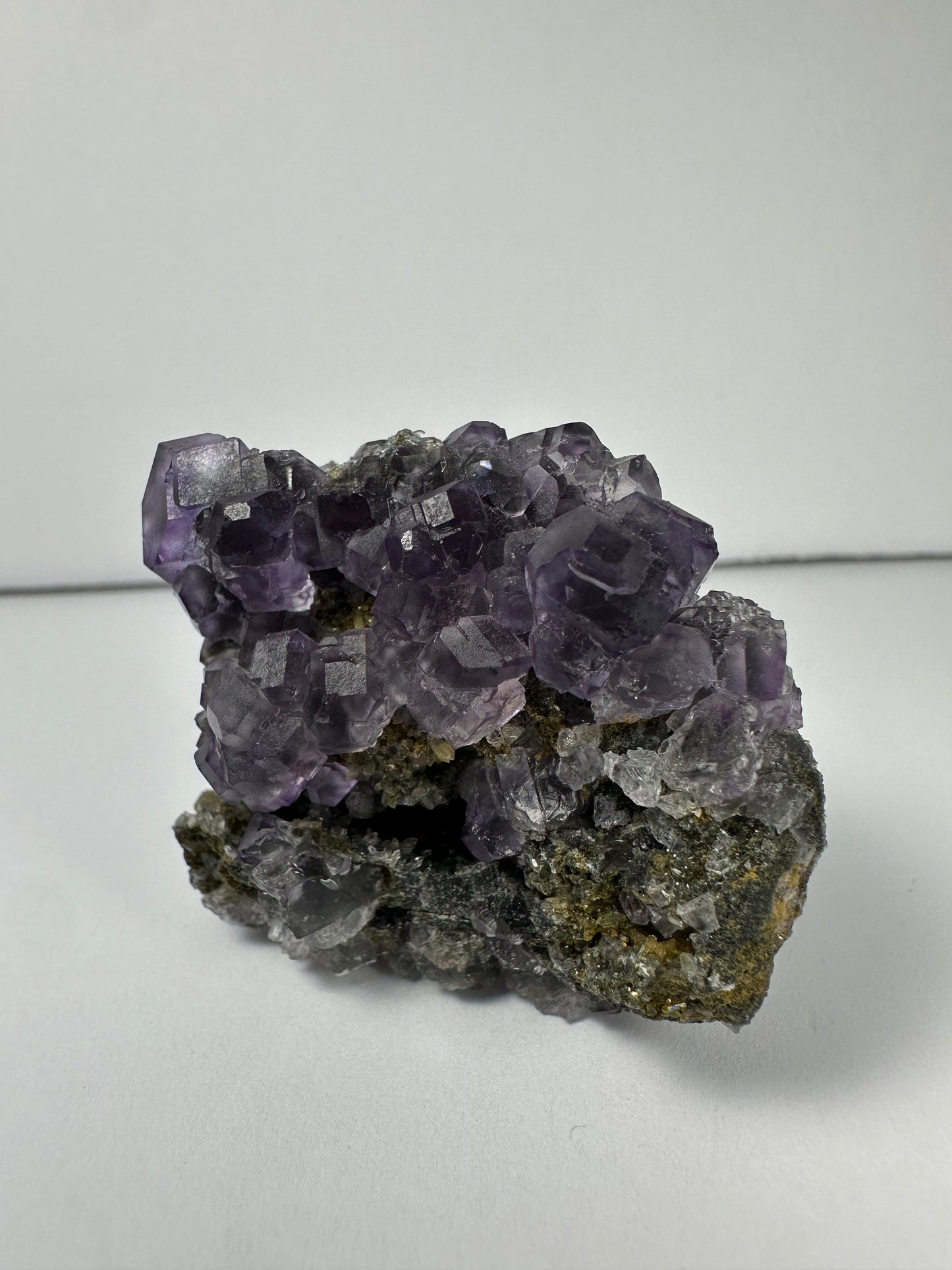Purple Dodecahedral Fluorite with Calcite on matrix – Minerals