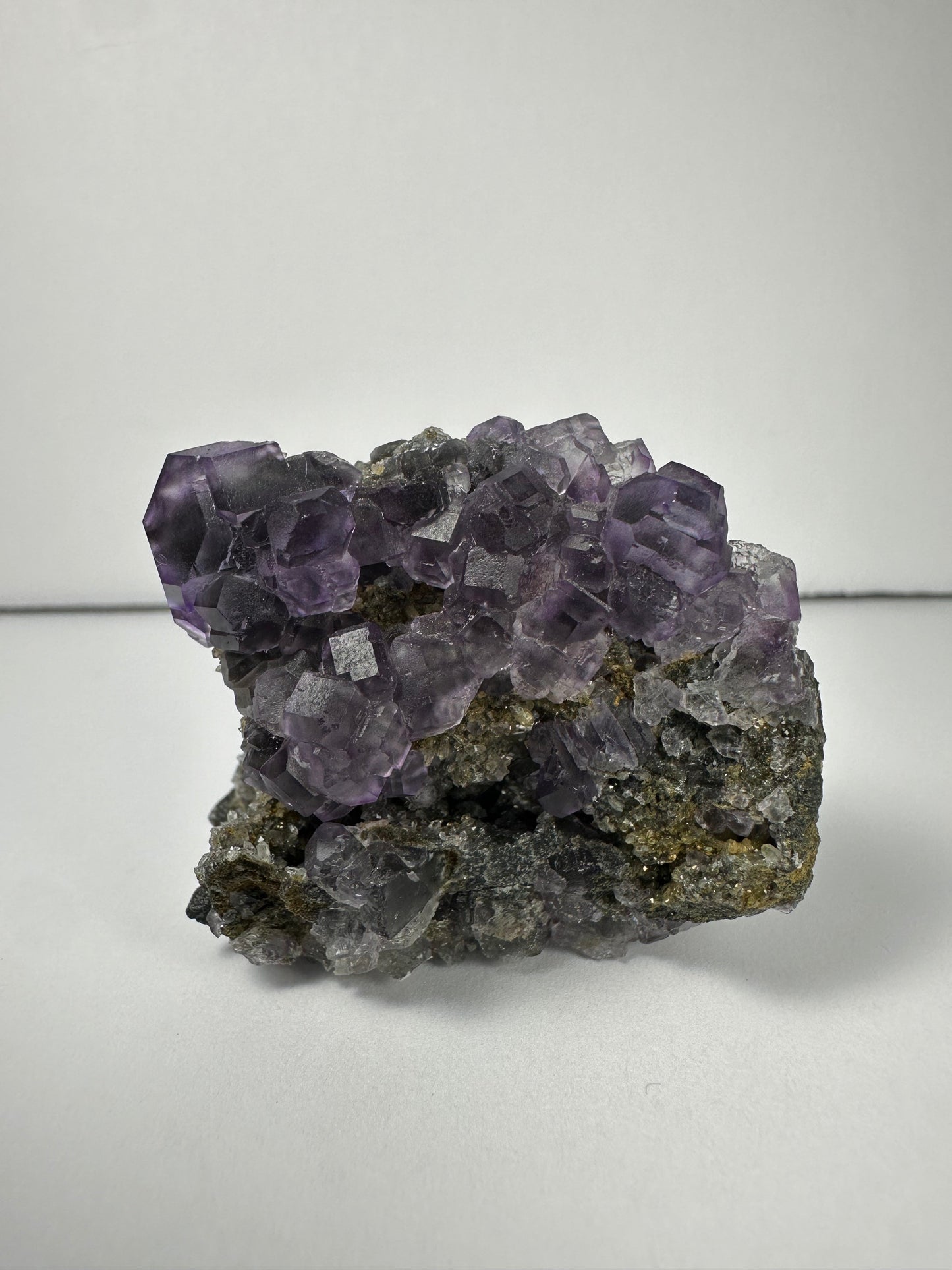 Purple Dodecahedral Fluorite with Calcite on matrix – Minerals