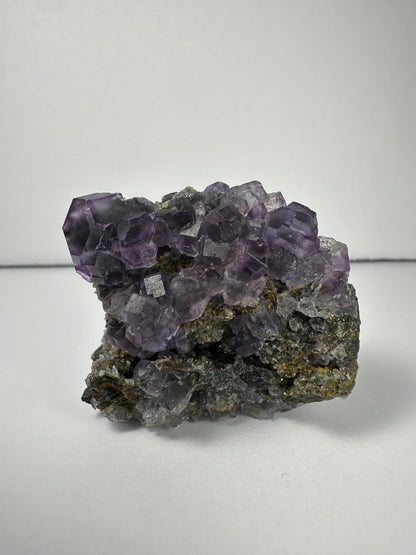 Purple Dodecahedral Fluorite with Calcite on matrix – Minerals