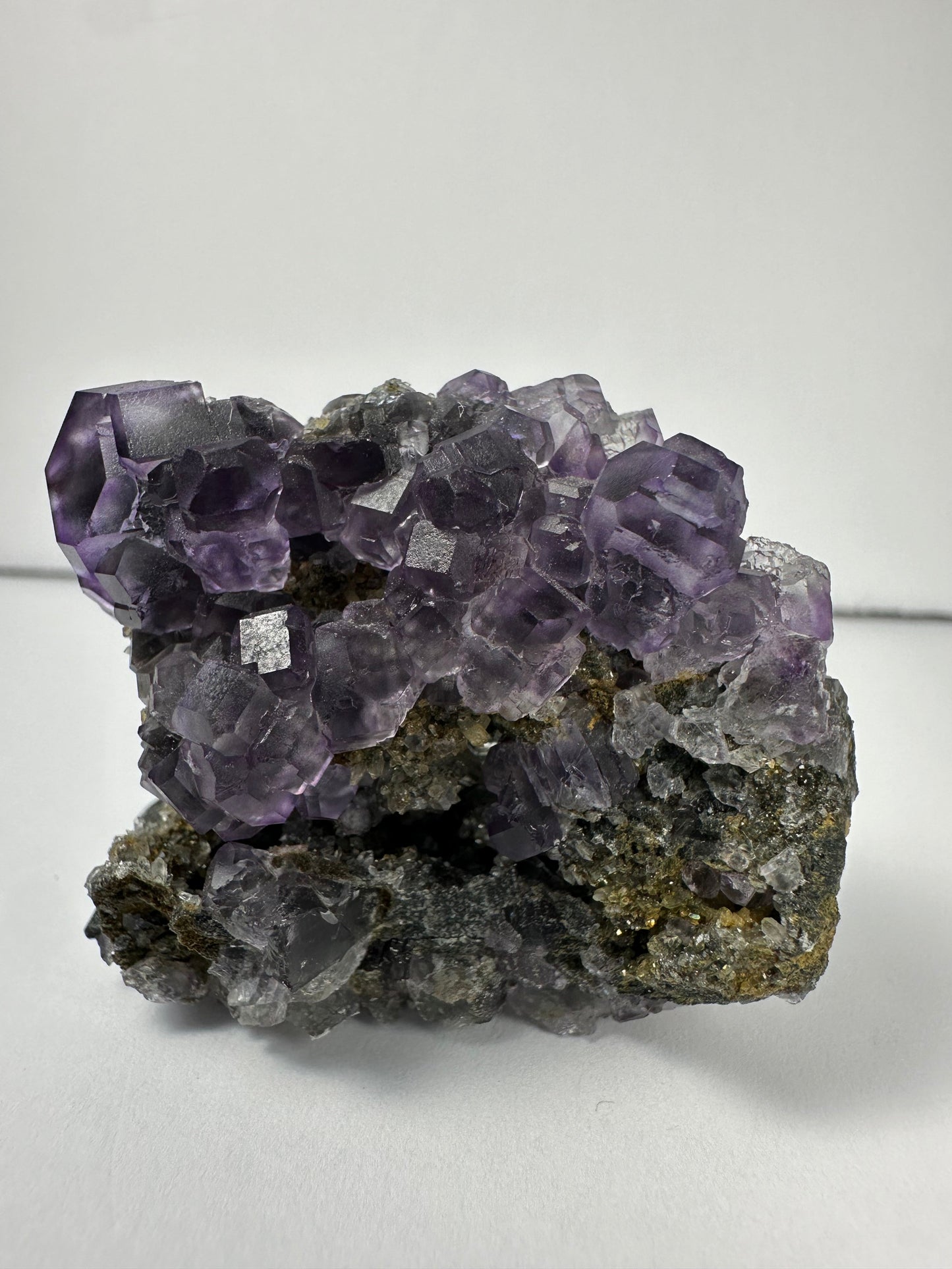 Purple Dodecahedral Fluorite with Calcite on matrix – Minerals