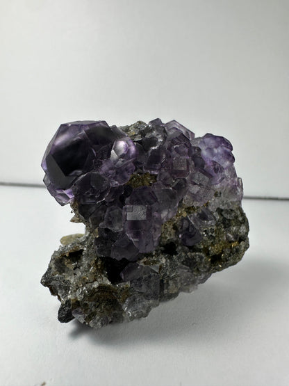 Purple Dodecahedral Fluorite with Calcite on matrix – Minerals
