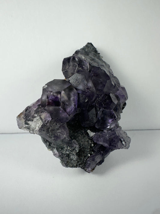 Purple Dodecahedral Fluorite with Calcite on matrix