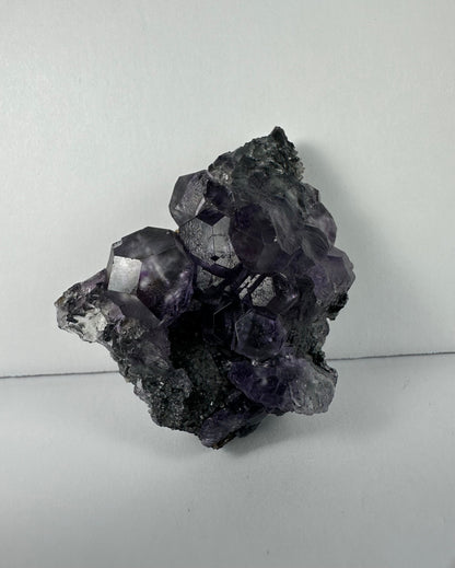 Purple Dodecahedral Fluorite with Calcite on matrix