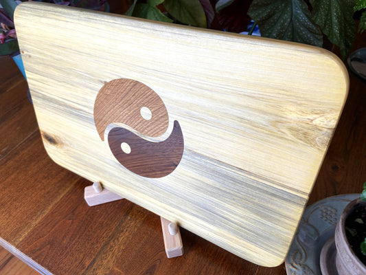 Poplar charcuterie board with Yin Yang inlay made from White Oak and Peruvian Walnut.