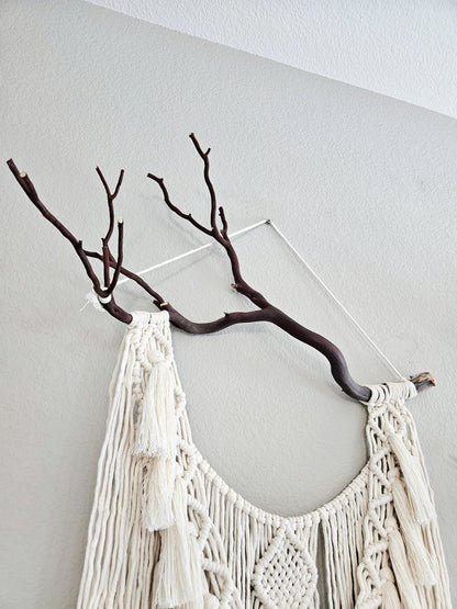 Macrame wall hanging on Manzanita branch.