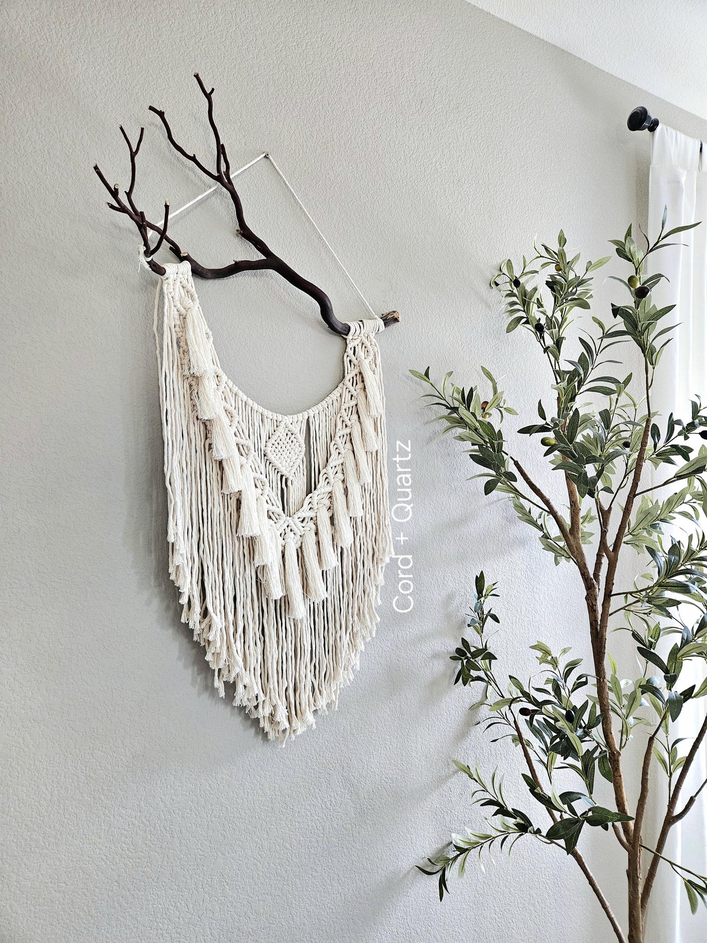 Macrame wall hanging on Manzanita branch.