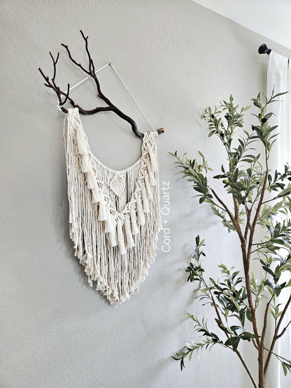 Macrame wall hanging on Manzanita branch.